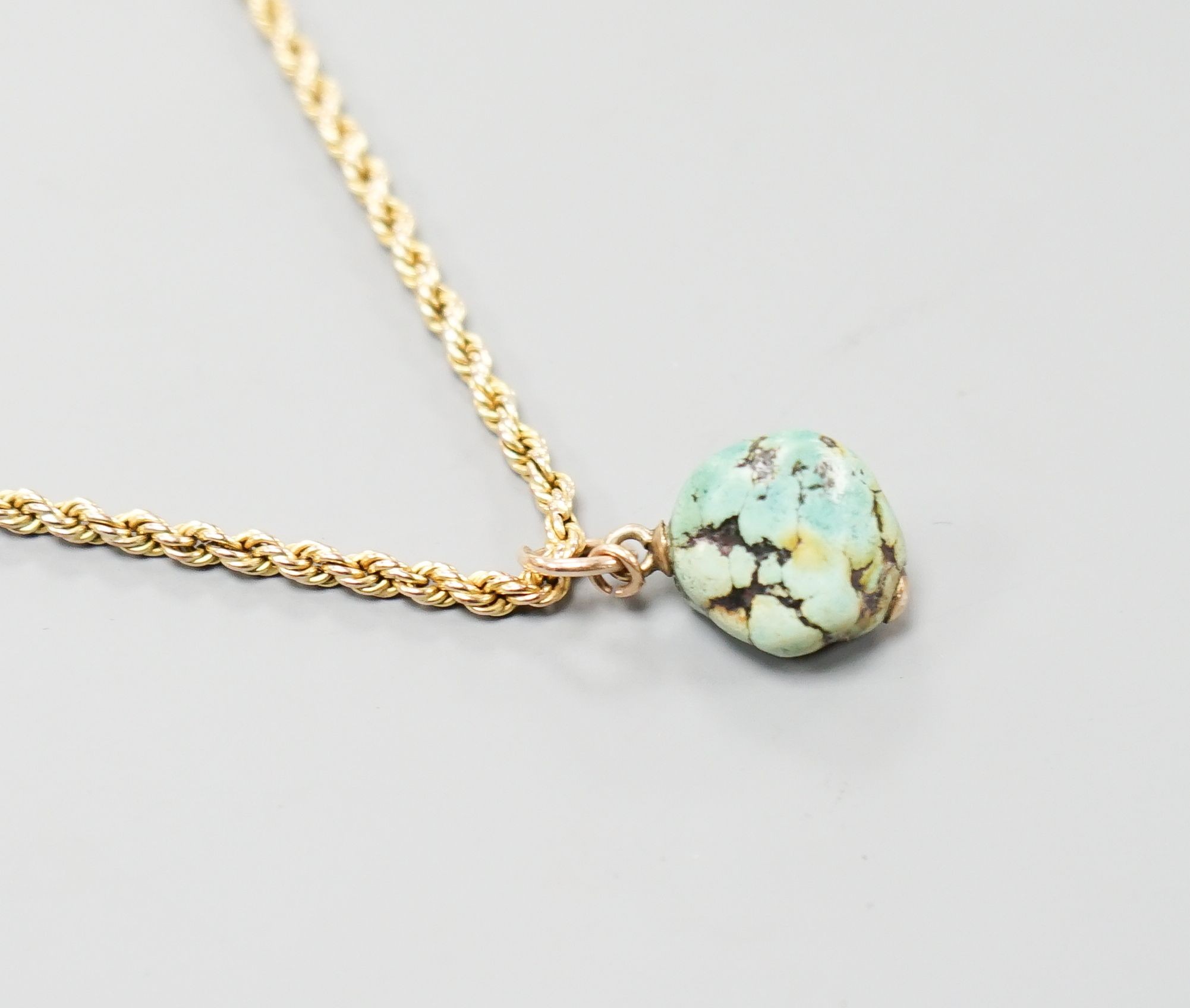 A 9ct rope twist guard chain, with turquoise pebble pendant, chain length, 146cm
